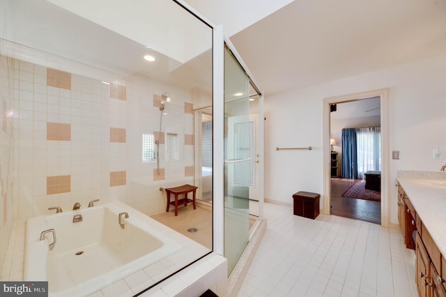 14 Quail Ridge Dr, Reading, PA 19607 - bathroom featuring vanity, a bath, tiled shower, and tile patterned flooring