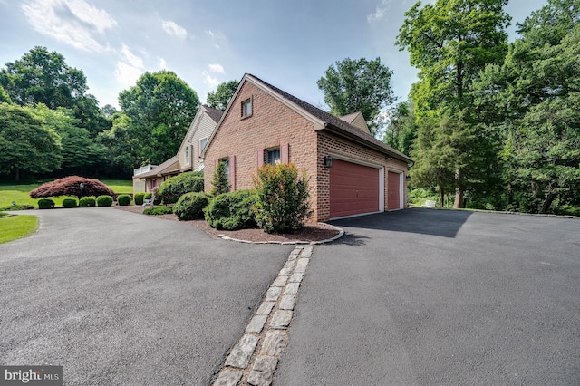 14 Quail Ridge Dr, Reading, PA 19607 - view of property exterior with brick siding, a garage, and driveway