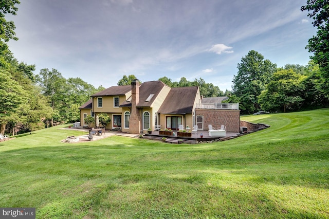14 Quail Ridge Dr, Reading, PA 19607 - rear view of property with a chimney, a yard, a patio, and brick siding