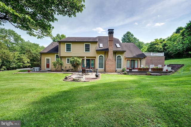 14 Quail Ridge Dr, Reading, PA 19607 - back of property with a patio area, a yard, and a chimney