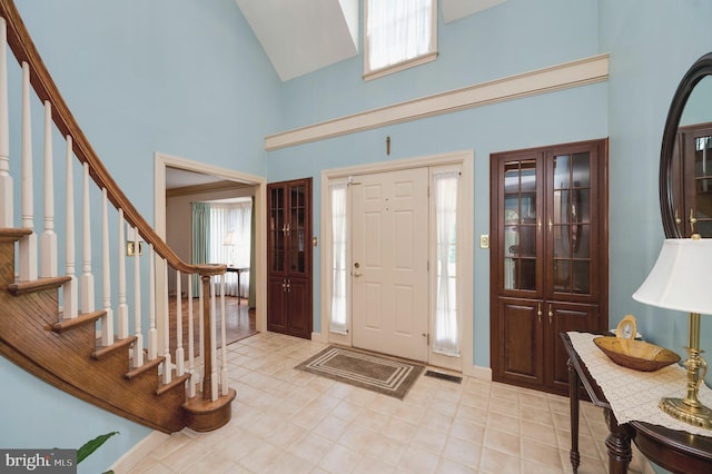 14 Quail Ridge Dr, Reading, PA 19607 - foyer entrance with high vaulted ceiling, stairway, and light tile patterned floors