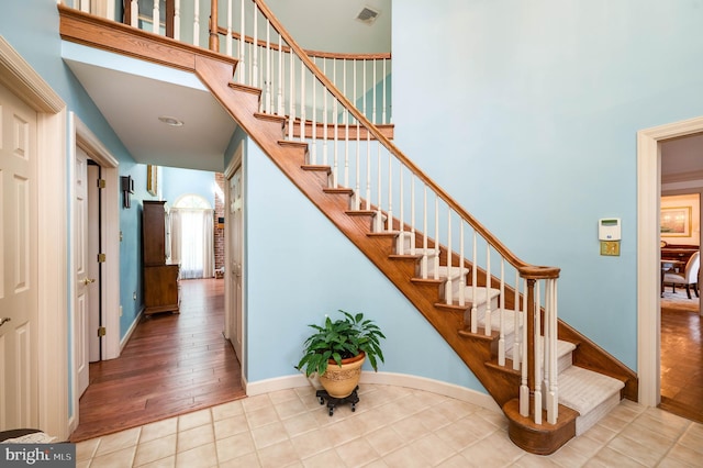 14 Quail Ridge Dr, Reading, PA 19607 - stairs featuring tile patterned flooring and a high ceiling