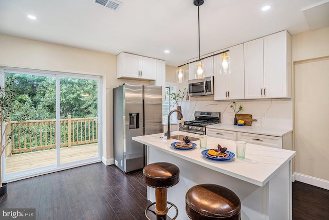 4641 Fernhill Rd, Philadelphia, PA 19144 - kitchen with appliances with stainless steel finishes, dark wood finished floors, white cabinetry, light countertops, and recessed lighting