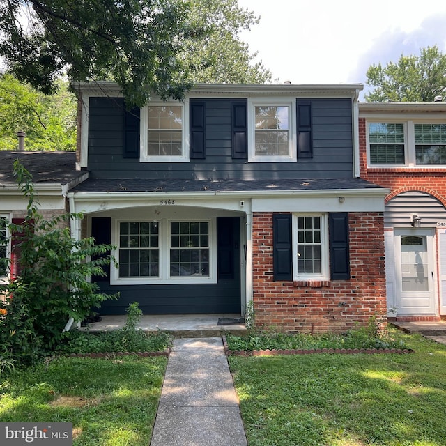 5468 Gloucester Rd, Columbia, MD 21044 - view of front facade featuring brick siding and a front lawn