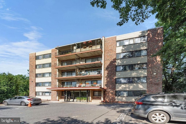 8308 Flower Ave Unit 403, Takoma Park, MD 20912 - view of apartment building / complex featuring uncovered parking