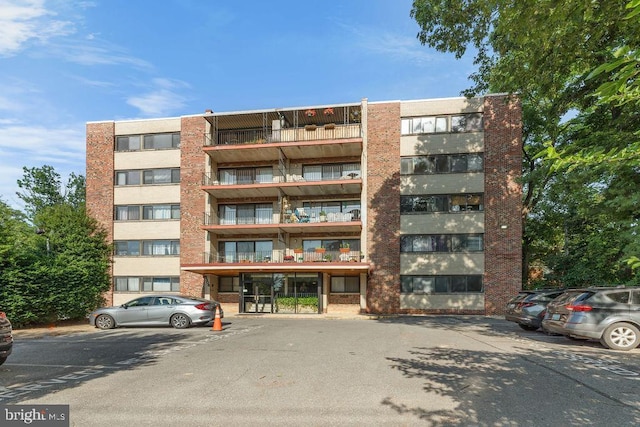 8308 Flower Ave Unit 403, Takoma Park, MD 20912 - view of apartment building / complex featuring uncovered parking