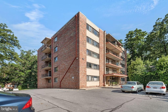 8308 Flower Ave Unit 403, Takoma Park, MD 20912 - view of apartment building / complex featuring uncovered parking