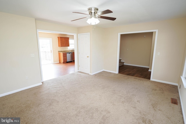 1322 Aspen Dr, Salisbury, MD 21804 - unfurnished living room featuring carpet, a ceiling fan, and stairway
