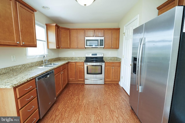 1322 Aspen Dr, Salisbury, MD 21804 - kitchen with appliances with stainless steel finishes, light wood-style floors, and brown cabinetry