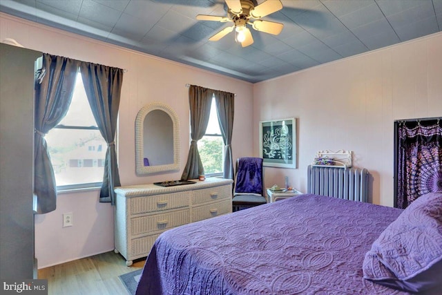 3314 Orchard Pl, Reading, PA 19605 - bedroom featuring radiator heating unit, light wood-style flooring, ornamental molding, and ceiling fan