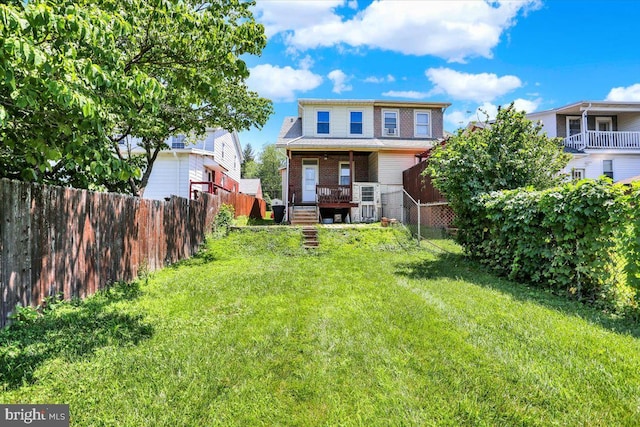 3314 Orchard Pl, Reading, PA 19605 - rear view of property featuring a fenced backyard, stairs, brick siding, and a deck