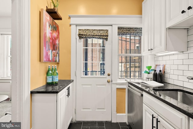 1833 S St NW Unit 2, Washington, DC 20009 - kitchen with stainless steel dishwasher, tasteful backsplash, white cabinetry, and dark stone countertops