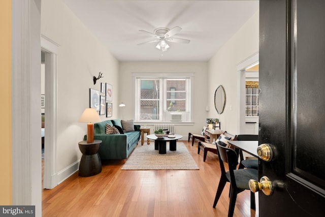 1833 S St NW Unit 2, Washington, DC 20009 - living area with ceiling fan, wood finished floors, and radiator