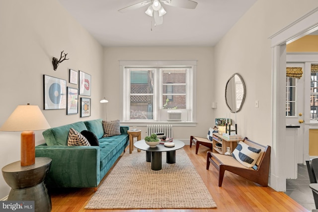 1833 S St NW Unit 2, Washington, DC 20009 - living room with radiator, a ceiling fan, and light wood-style floors