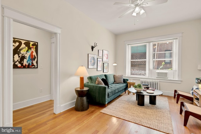 1833 S St NW Unit 2, Washington, DC 20009 - living room with radiator heating unit, light wood-type flooring, and a ceiling fan