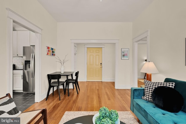 1833 S St NW Unit 2, Washington, DC 20009 - living area with baseboards and light wood finished floors