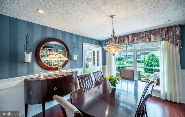 1421 Custom House Sq, Bensalem, PA 19020 - dining space with wallpapered walls, wainscoting, a textured ceiling, and wood finished floors