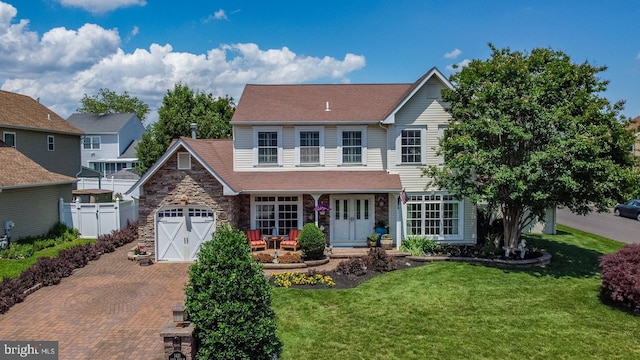 1421 Custom House Sq, Bensalem, PA 19020 - view of front facade featuring stone siding, decorative driveway, french doors, and an attached garage