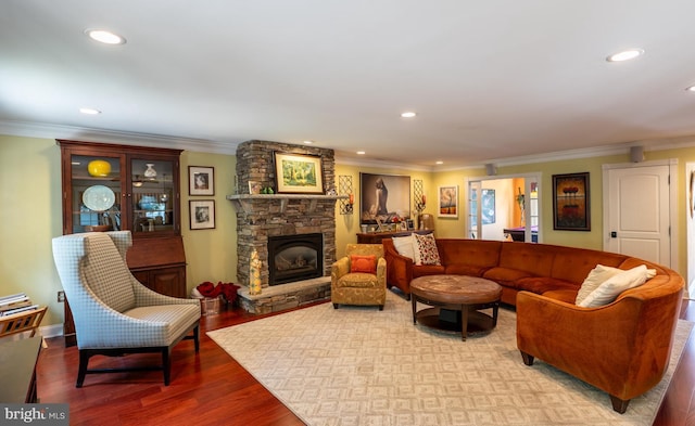 1421 Custom House Sq, Bensalem, PA 19020 - living area with a stone fireplace, ornamental molding, wood finished floors, and recessed lighting