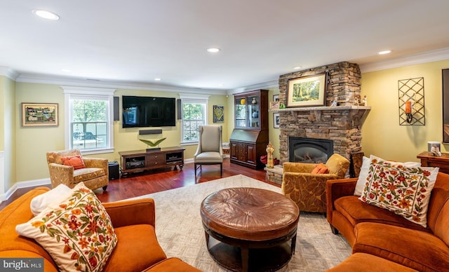 1421 Custom House Sq, Bensalem, PA 19020 - living room featuring ornamental molding, healthy amount of natural light, wood finished floors, a fireplace, and recessed lighting