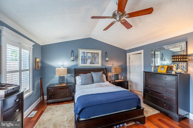 1421 Custom House Sq, Bensalem, PA 19020 - bedroom featuring wood finished floors, lofted ceiling, a textured ceiling, crown molding, and a ceiling fan