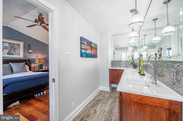 1421 Custom House Sq, Bensalem, PA 19020 - bar with wood finished floors, a ceiling fan, tasteful backsplash, lofted ceiling, and decorative light fixtures