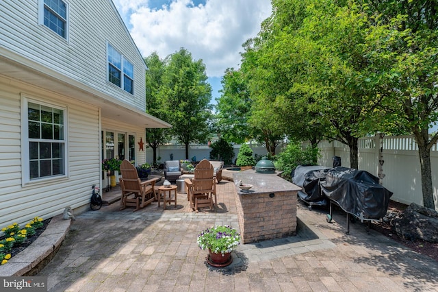 1421 Custom House Sq, Bensalem, PA 19020 - fenced backyard with a patio, an outdoor kitchen, and an outdoor hangout area