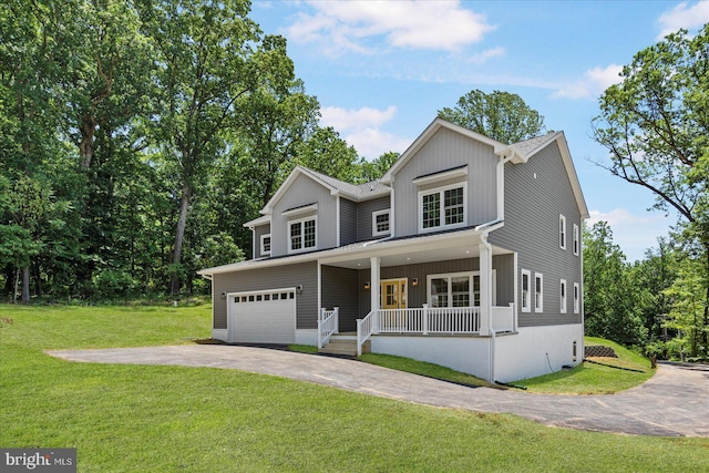 4615 Deer Park Rd, Owings Mills, MD 21117 - view of front of home featuring covered porch, driveway, a front yard, and a garage