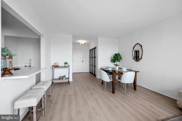 5500 Holmes Run Pkwy Unit 1103, Alexandria, VA 22304 - dining space featuring light wood-style flooring and baseboards