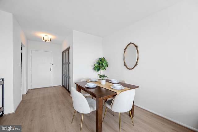 5500 Holmes Run Pkwy Unit 1103, Alexandria, VA 22304 - dining space featuring light wood-style flooring and baseboards