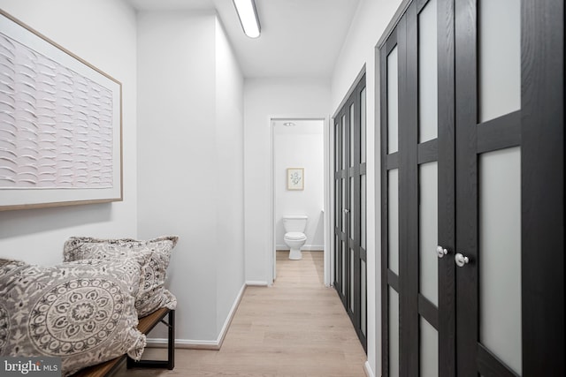5500 Holmes Run Pkwy Unit 1103, Alexandria, VA 22304 - hallway featuring light wood-style floors and baseboards
