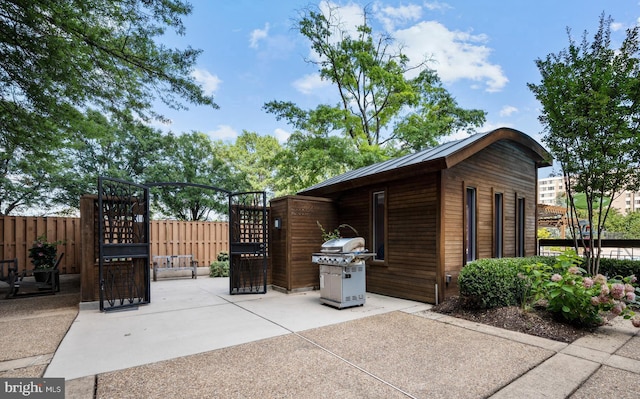 5500 Holmes Run Pkwy Unit 1103, Alexandria, VA 22304 - view of patio with grilling area and an outdoor structure