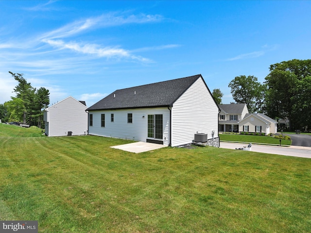 564 Monocacy Trl, Spring Grove, PA 17362 - back of house featuring a yard, a patio, and roof with shingles