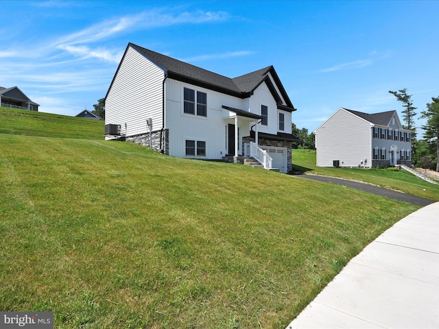 564 Monocacy Trl, Spring Grove, PA 17362 - bi-level home with a garage, a front yard, driveway, and stone siding