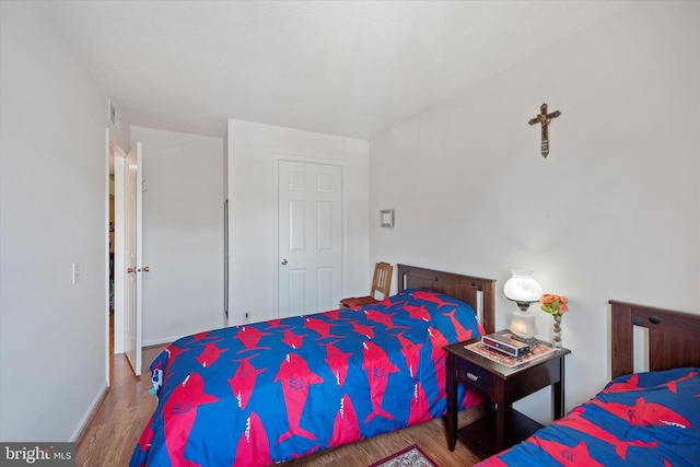 119 Prosperity Ave SE Unit C, Leesburg, VA 20175 - bedroom with wood finished floors and baseboards