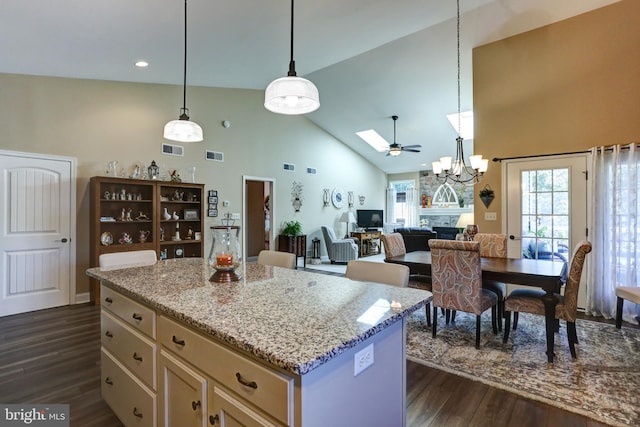6210 Thornhill Ln, Mechanicsburg, PA 17050 - kitchen featuring high vaulted ceiling, dark wood finished floors, pendant lighting, light stone countertops, and recessed lighting