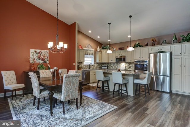 6210 Thornhill Ln, Mechanicsburg, PA 17050 - dining space with a chandelier, dark wood-style flooring, high vaulted ceiling, and recessed lighting