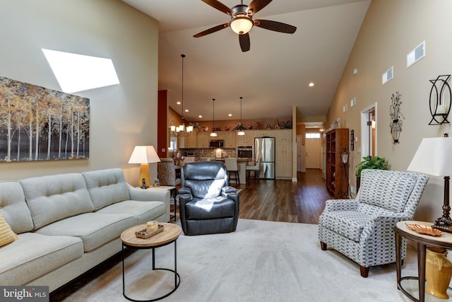 6210 Thornhill Ln, Mechanicsburg, PA 17050 - living area with high vaulted ceiling, ceiling fan, wood finished floors, a skylight, and recessed lighting