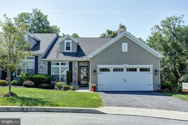 6210 Thornhill Ln, Mechanicsburg, PA 17050 - view of front of property with stone siding, driveway, a garage, and a front yard