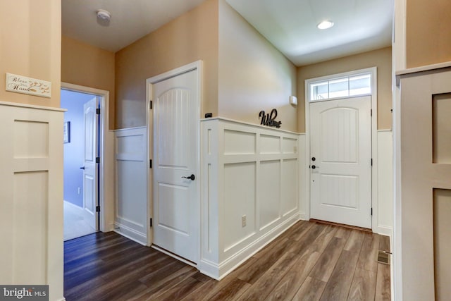 6210 Thornhill Ln, Mechanicsburg, PA 17050 - entryway featuring dark wood-style floors, wainscoting, and a decorative wall