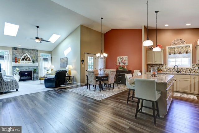 6210 Thornhill Ln, Mechanicsburg, PA 17050 - kitchen with a kitchen island, a skylight, a chandelier, high vaulted ceiling, and plenty of natural light