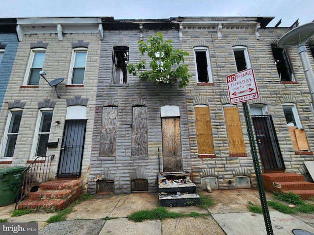 1926 Christian St, Baltimore, MD 21223 - view of property featuring stone siding