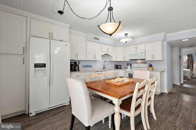 4 46th St Unit 101, Ocean City, MD 21842 - dining room featuring dark wood-style floors and ornamental molding