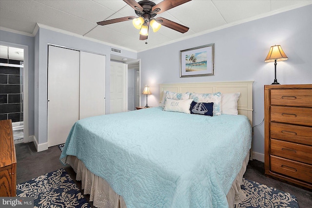 4 46th St Unit 101, Ocean City, MD 21842 - bedroom featuring dark carpet, a closet, ornamental molding, and ceiling fan