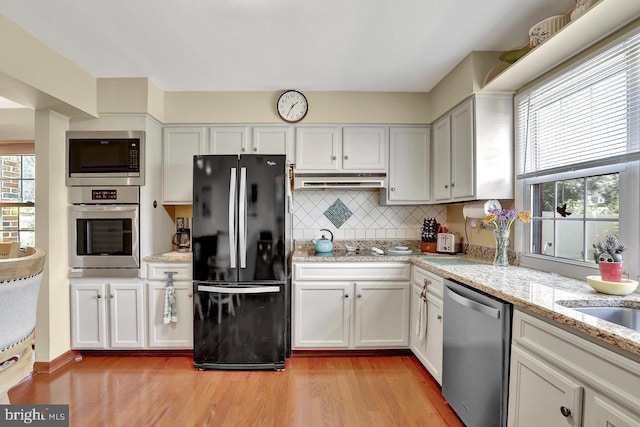 78 Kent Ave, Marlton, NJ 08053 - kitchen with appliances with stainless steel finishes, light wood-type flooring, backsplash, and white cabinetry
