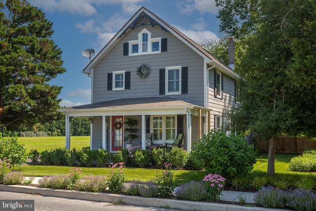 503 Mulberry St, Milton, DE 19968 - view of front facade featuring covered porch and a chimney