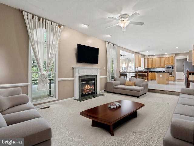 1505 Ridge Forest Way, Hanover, MD 21076 - living room with a ceiling fan, a premium fireplace, light carpet, and recessed lighting
