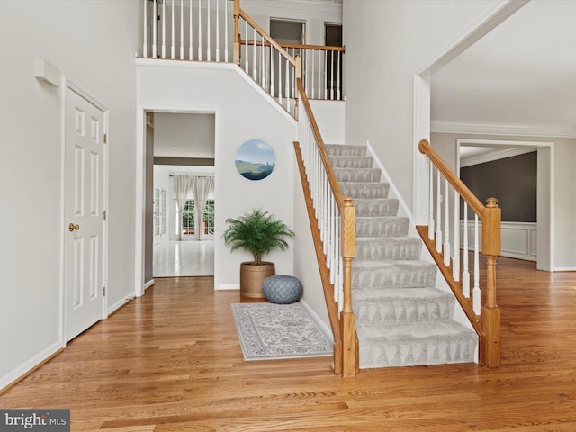 1505 Ridge Forest Way, Hanover, MD 21076 - staircase with wood finished floors, ornamental molding, and a high ceiling