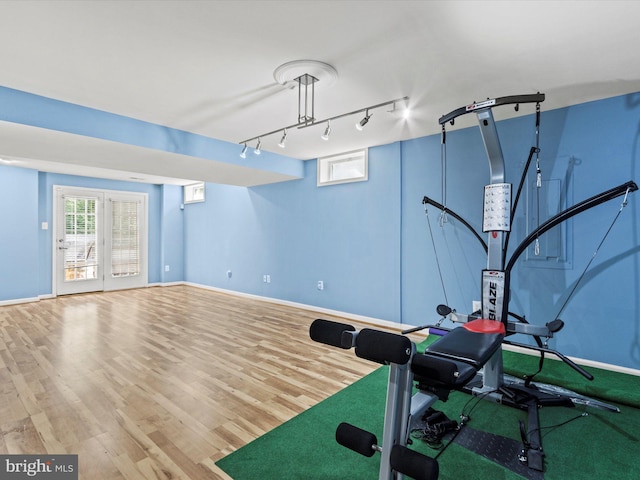 1505 Ridge Forest Way, Hanover, MD 21076 - workout room with wood finished floors and track lighting