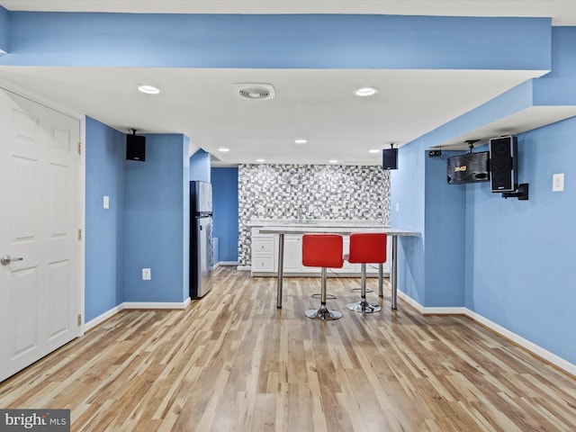 1505 Ridge Forest Way, Hanover, MD 21076 - interior space with light wood finished floors, a bar, and recessed lighting